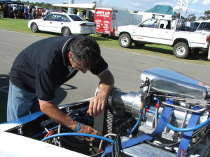 thumb Russell adjusting engine at the track